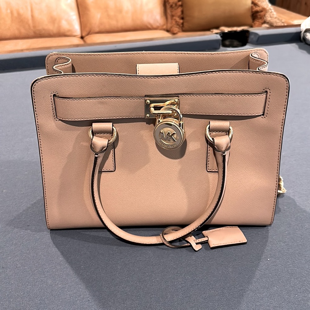 Michael Kors, pink purse with arm strap and shoulder strap